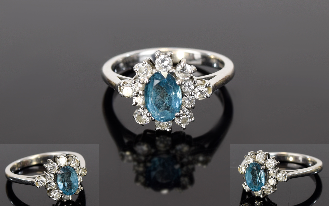18ct White Gold Set Blue Topaz and Diamond Cluster Ring.