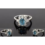 18ct White Gold Set Blue Topaz and Diamond Cluster Ring.