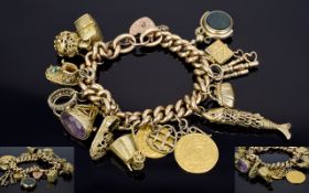 An Impressive Vintage 9ct Gold Albert Chain & Padlock Loaded with 12 9ct Gold Charms and a South