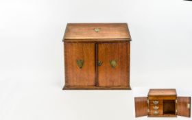 Oak Smokers Box A late 19th/early 20th century miniature smokers cabinet in warm aged oak.