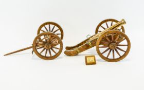 A Handmade Miniature French Cannon An intricate reproduction wood and brass model cannon,