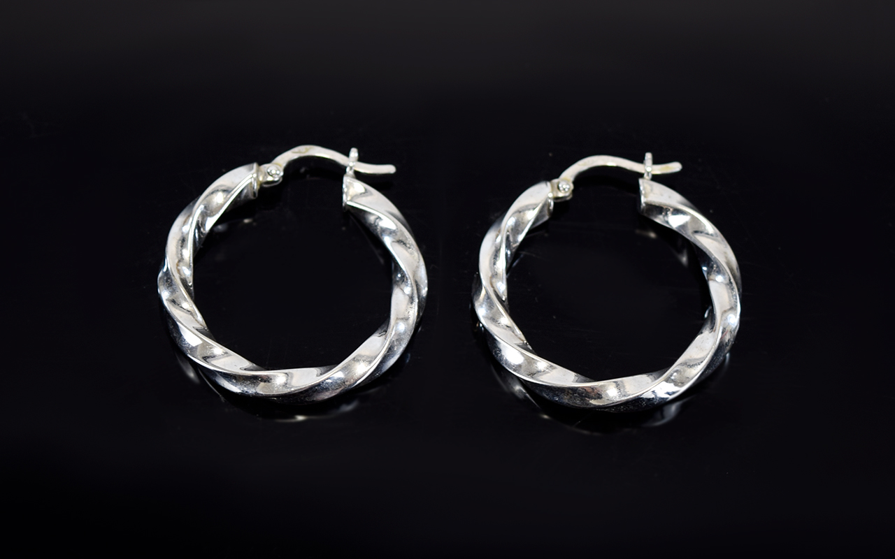 Ladies 9ct White Gold Pair of Hoop Earrings. In As New Condition and Fully Hallmarked for 9ct Gold.