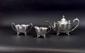 Plated Tea Service Late 19th century EPNS footed teapot, milk jug and sugar bowl.