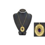 A Fine 9ct Gold Oval Shaped Pendant Set with a Large Faceted Amethyst of Excellent Colour,