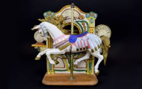 A Reproduction Musical Ceramic Carousel Horse Figure Ceramic figure against wooden box,