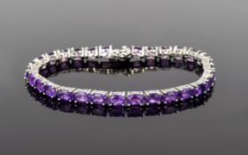 A Nice Quality Amethyst Set Silver Line Bracelet, Set with 34 Amethysts of Excellent Colour.