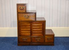 Japanese Step Tansu Hardwood Tansu Containing Four Sliding Doors And Five Drawers. Height 31 Inches,