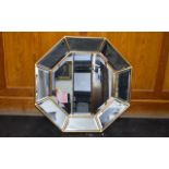 A Contemporary Octagonal Mirror Bevelled glass mirror in burnished gilt frame with central octagon