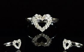 Diamond Heart Ring, a cluster of baguette cut diamonds, totalling .