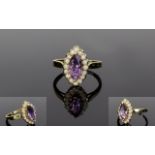 Ladies 9ct Gold Amethyst and Opal Dress Ring. The Marquise Cut Amethyst Surrounded by Opals.