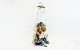 Vintage String Puppet In the form of a scary witch complete with straw broomstick.