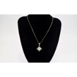 Diamond Cluster Pendant, a square of 16 close set, round cut diamonds,