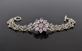 A Nice Quality - Ornate Silver Bracelet Set with Amethysts with Flower head Setting to Centre of