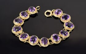 Amethyst Line Bracelet, twelve oval cut amethysts of good colour, totalling 24cts,