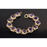 Amethyst Line Bracelet, twelve oval cut amethysts of good colour, totalling 24cts,