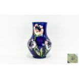 Moorcroft Tube lined and Impressive Bulbous Vase 'Big Poppy' design on blue ground. label to base.