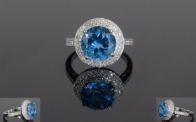 14ct White Gold Blue Topaz & Diamond Ring, Set With A Central Round Topaz (Estimated Weight 5,