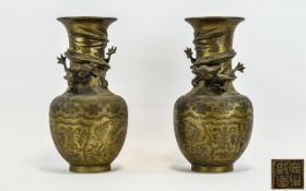 A Pair Of Oriental Cast Metal Vases Two in total with impressed characters to base,