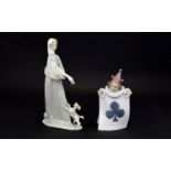 A Lladro Figure of a Young Girl Carrying a Goose, with a Little Dog by Her Feet. 10.5 Inches High.