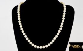 Well Matched High Quality Single Strand White Pearl Necklace with 14kt Gold Clasp.