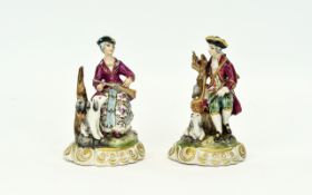 German 19th Century Pair of Hand Painted Porcelain Figures of Male and Female Hunters with Guns,