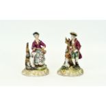 German 19th Century Pair of Hand Painted Porcelain Figures of Male and Female Hunters with Guns,