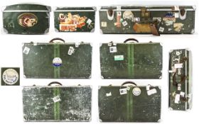 Collection Of Four Metal Travel Suitcases With Various Destination Labels