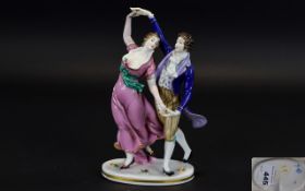German Figure of a Regency Style Dancing Couple, the lady in a flowing,