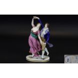 German Figure of a Regency Style Dancing Couple, the lady in a flowing,