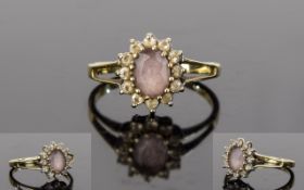 Ladies 9ct Gold Dress Ring Flower head setting with attractive lavender grey central faceted stone.
