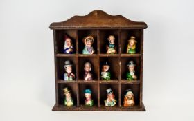 1983 Dickens House Hand Painted Set of Candle Snuffers housed in wooden display cabinet.