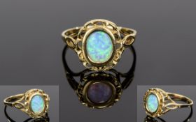 Ladies 10ct Yellow Gold Opal Set Dress Ring with Open work Bezel and Shoulders. Marked 10ct.