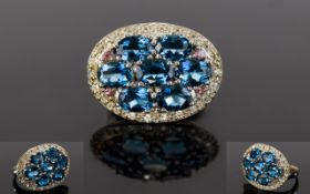 London Blue Topaz Oval Cluster Ring, comprising seven oval cuts of the deepest shade of blue topaz,