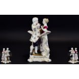 German Figure Group of a Couple Playing a Duet, the pair standing side by side, facing each other,