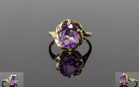 Amethyst Solitaire Ring set in 9ct gold; an oval cut of 2.