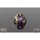 Amethyst Solitaire Ring set in 9ct gold; an oval cut of 2.