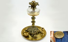 Circular Brass Topped Side Table. Together with a brass Oil Lamp. PLus a couple of brass oddments.
