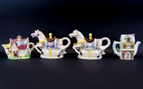 Leonardo Collection Novelty Teapots comprising townhouse, village church and two fairground horses.
