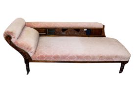 Chaise Lounge Antique day bed in dark wood with carved head and back rest detailing.