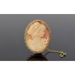 A Nice Quality Oval Shaped Shell Cameo Pendant/Brooch In A 9ct Gold Mount Depicting an image of a