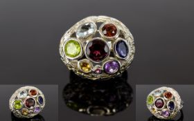 Multi Gemstone Ring, bezel set round and oval cut gemstones including garnet, amethyst, peridot,