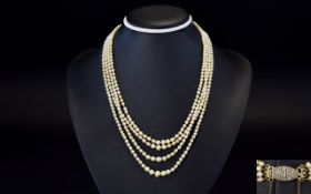 19th Century Period Very Fine 4 Strand Natural Pearl Necklace with a Gold Clasp and Safety Chain,