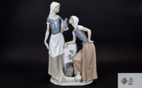 Neo By Lladro Large Figure Group A large Neo figure in the form of two maidens gathering water from