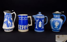 Four Various Jasper Style Jugs, comprisi