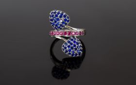 Sapphire and Ruby Cluster Crossover Ring