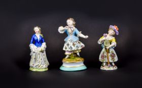 Three Various Small Female Figures comprising a Samson-Chelsea Derby figure showing a girl with a