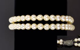 A Double Strand - Well Matched Cultured Pearl Bracelet with Silver and Marcasite Clasp From The