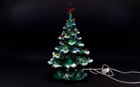 Green Ceramic Christmas Tree Lamp decorated throughout with plastic bird figures and star to top.