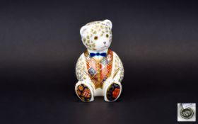 A Royal Crown Derby Paperweight In The Form Of A Teddy Bear Seated bear figure in white ceramic