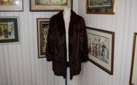 Vintage Coney Fur Coat Ladies brown rabbit fur coat with small stand collar and fitted cuff detail.